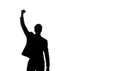 A figure raises a fist in a powerful stance, symbolizing strength, resistance, and unity.