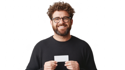 A smiling man holds a blank card, wearing glasses and a dark sweater.