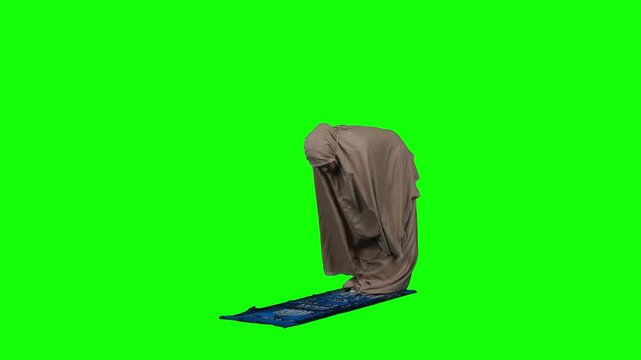 Muslim Woman in Prostration During Prayer on Green Screen Background