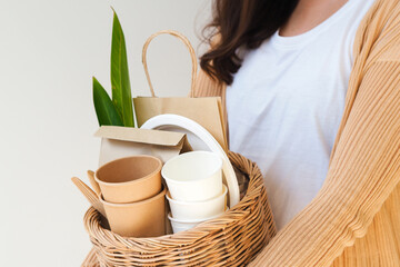 Woman hand holding basket with Eco-friendly packaging. Zero waste, eco friendly and recycling concept.