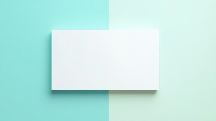 Fototapeta premium A white rectangular shape is set against two different color backgrounds, one light blue and the other mint green. The backgrounds should be simple yet elegant