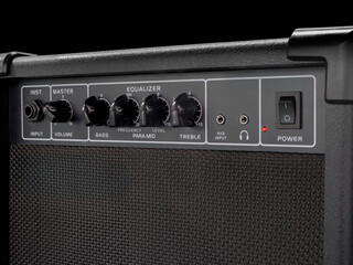 guitar amplifier on black background, with EQ for bass electric guitar, close up shot