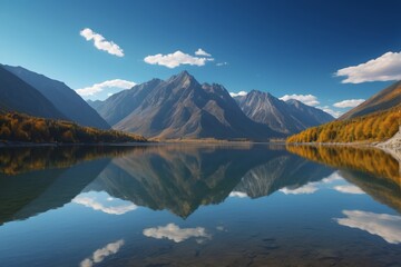 Fototapeta premium mountains are reflected in the water of a lake in the mountains