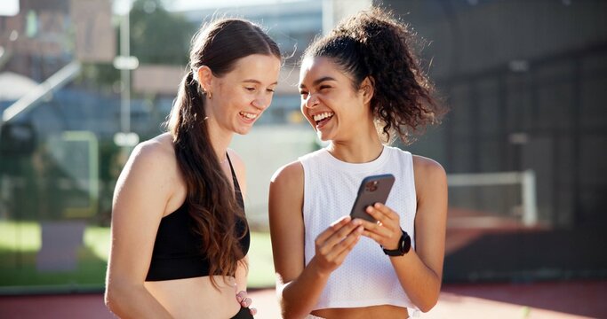 Sports, happy and people with phone on tennis court for social media post, funny message and online meme. Fitness club, internet and women laugh for smartphone chat after training, practice and match