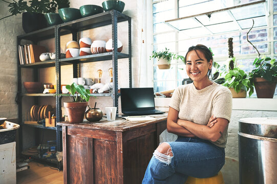Asian woman, portrait and ceramic artist with pottery for small business startup at eco friendly store. Happy, female person or environmentalist with smile for clay design or creations at workshop