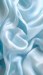 Obraz premium Light blue silk fabric elegantly draped and softly illuminated