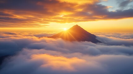 A mountain peak emerging from a sea of golden clouds at sunrise