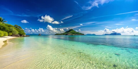 Fototapeta premium Serene Tropical Beach with Clear Water and Lush Green Landscape