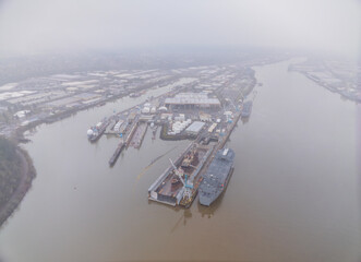 A large body of water with a few boats docked at a pier