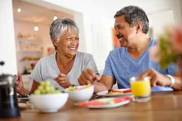 Smile, elderly couple and breakfast in home for healthy relationship, wellness and support for love. Retirement, man and woman with morning food, connection and commitment to marriage with partner