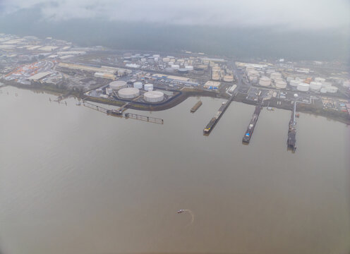 A city with a large body of water in the background