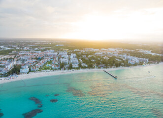 A beautiful beach with a city in the background