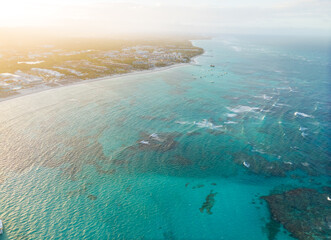 A beautiful blue ocean with a few boats in the water