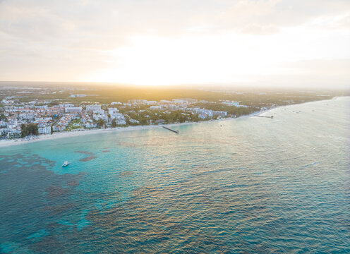 A beautiful blue ocean with a city in the background