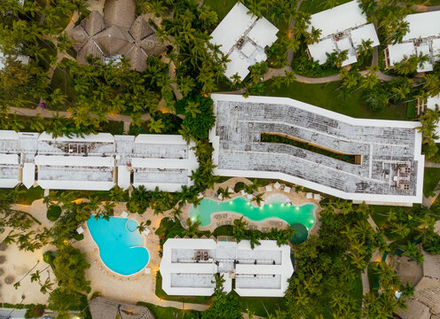 A view of a resort with a pool and several buildings