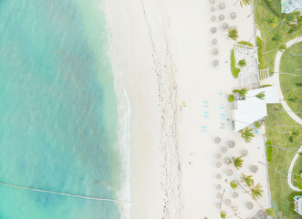 A beach with a white building in the background