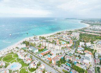 A beach town with a lot of buildings and a large body of water