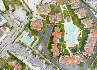 A residential area with a pool and a few houses
