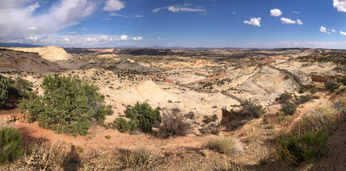 A breathtaking view of the winding highway cutting through Grand Staircase-Escalante near Boulder, Utah, captured on a clear day.