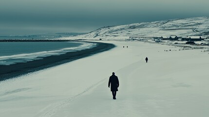 Person Walking on a Snowy Beach in Winter