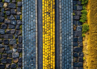 Fototapeta premium Aerial Drone View of Volcanic Stone Road & Gray Yellow Brick Sidewalk Texture