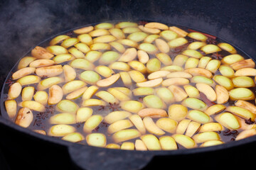 A pan of apples is boiling in a pot