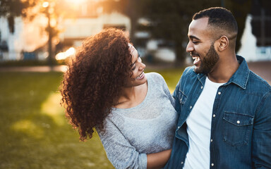 Love, couple and laughing outdoor together for sunset date, romance or funny conversation in...