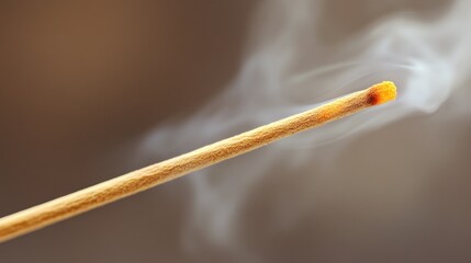 Burning incense stick, smoky aroma, close-up, blurred background, spa