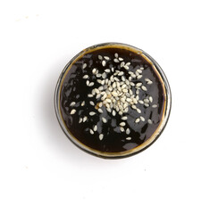 bowl with teriyaki sauce and sesame seeds
