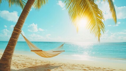 Naklejka premium Hammock with palm tree on tropical beach for summer background