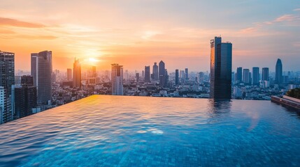 rooftop infinity pool with city skyline view at sunset