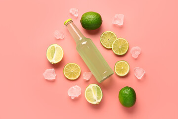 Composition with bottle of fresh soda and lime on pink background