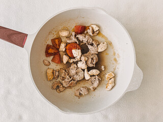 High protein meal, stir fried pork and chicken breast served in hot pan.