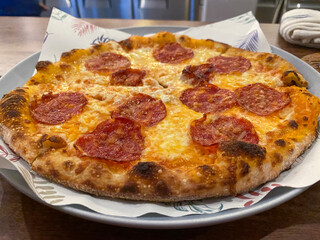 Salami pizza with a lot of cheese