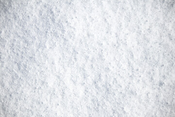 Snow background. Snow surface in winter. Pattern, texture. Top view, above. Horizontal photo. Copy space, blank, empty.