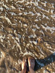 feet on the beach