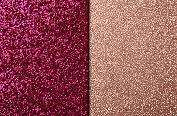 Fototapeta premium The delicate pastel colors of a light pink background are elevated by the presence of scattered golden metal glitter, resulting in a minimalistic, festive, and glamorous aesthetic