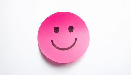 Fototapeta premium Pink sticky paper note with drawn happy emoji face on white background. Emotion, mental state