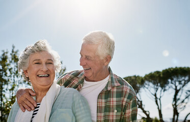 Senior couple, laugh and hug on patio for anniversary date, retirement holiday and bonding. Elderly...