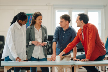 Diverse team collaborating in modern office setting
