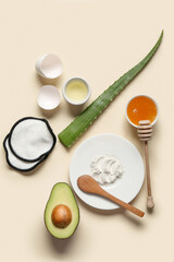 Composition with ingredients for handmade cosmetics and cotton pads on color background