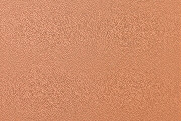 Fototapeta premium Orange textured background with subtle pattern.
