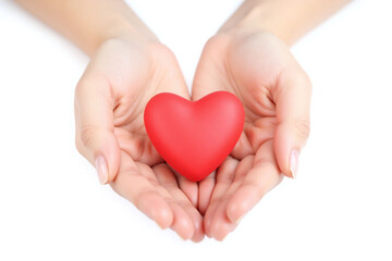 person holding a red heart in their hands