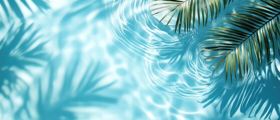 Top view of a blue calm and clear calm water surface, water texture with ripples and shadow of palm leaves.