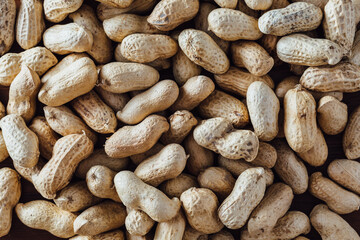Peanuts on wooden background