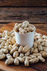 Peanuts on wooden background