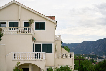 House nestled by mountains and bay