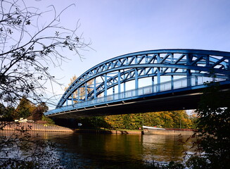 Obraz premium Bridge over the River Weser in Autumn in the Town Nienburg, Lower Saxony