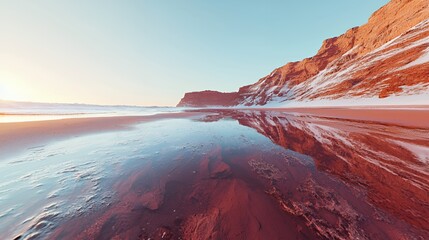 Red Sand Desert Landscape with Snow Capped Mountains and Water Reflection at Sunset