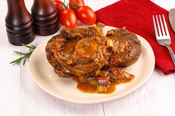 Italian cuisine - ossobuco with sauce